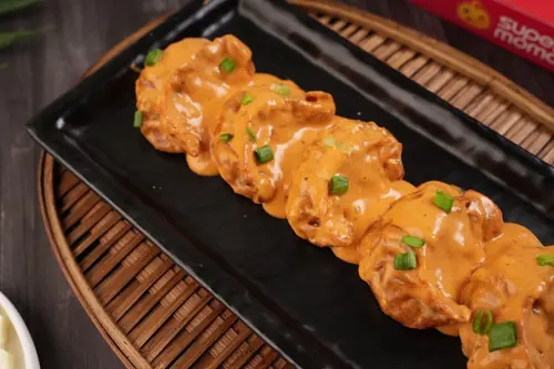 Chicken Cheese Pan Fried Momo in Butter Masala