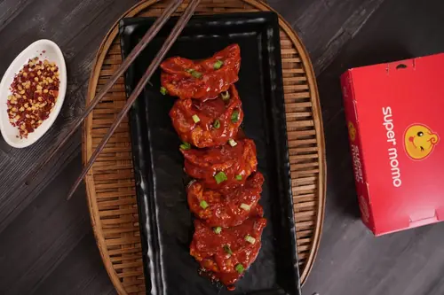 Chicken Cheese Pan Fried Momo in Schezwan