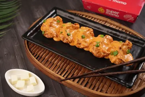 Paneer Tikka Fried Momo in Butter Masala